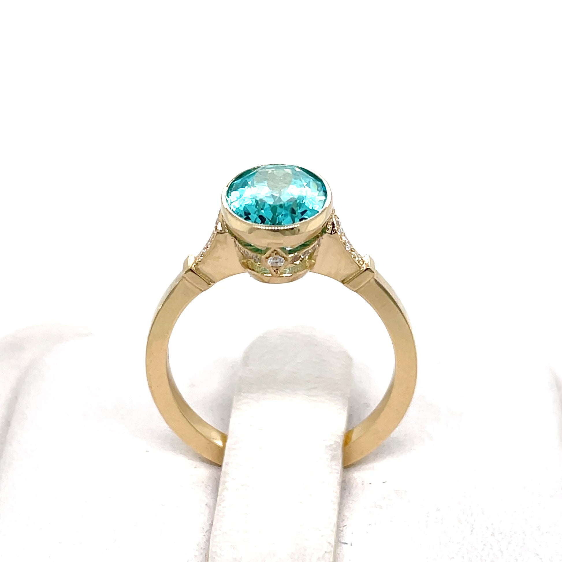 Gold ring with a Paraiba lab grown color stone
